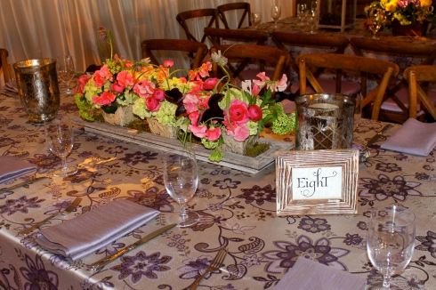 23. Table Numbers amidst centerpieces and branch-like chairs